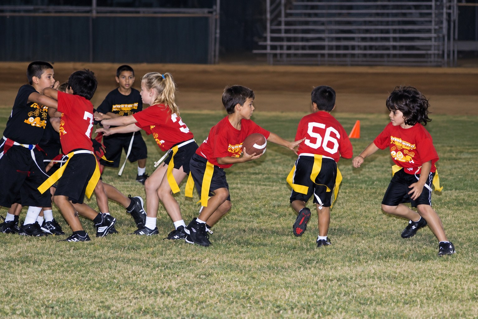 Young DSA athletes playing flag football