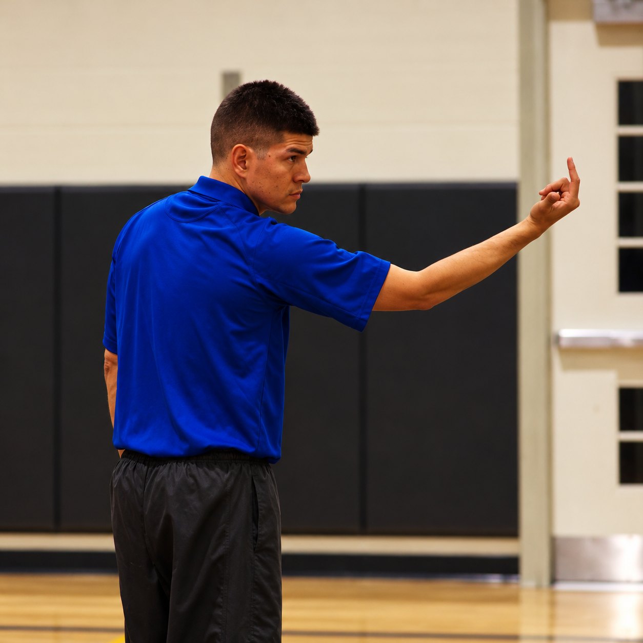 Founder Jeremias Valencia coaching on the court